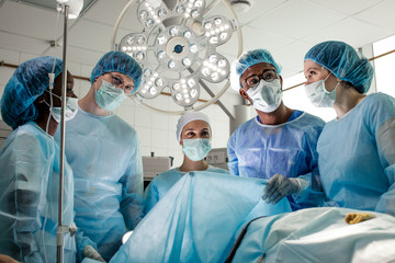 medical specialists having a break after operation in the clinic.