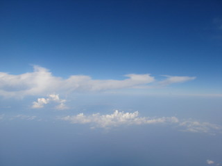 Panorama of cloudy sky with a height of 9000 m in flight above the Mediterranean Sea.