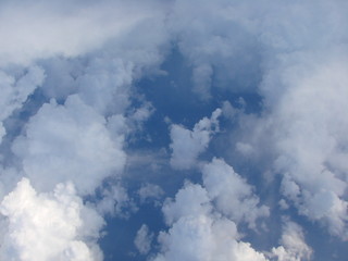 Panorama of a soft, snow-white cloud blanket in heavenly blue from a height of 9,000 m above the Mediterranean Sea.