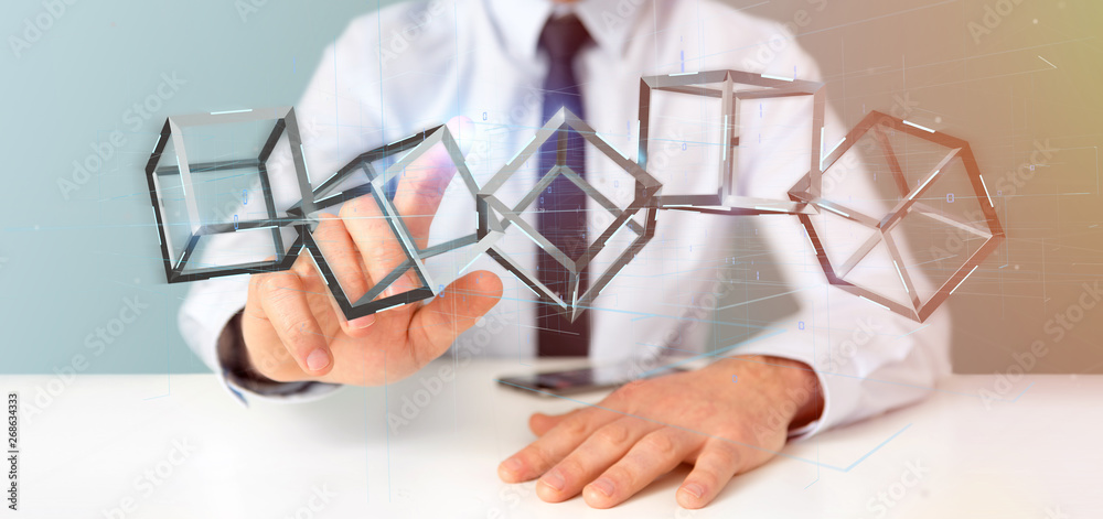 Poster businessman holding a 3d rendering blockchain cube isolated on a background