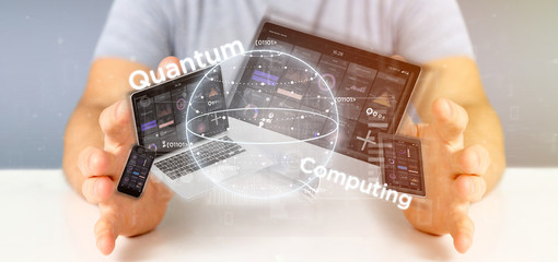 Businessman holding Quantum computing concept with qubit and devices 3d rendering
