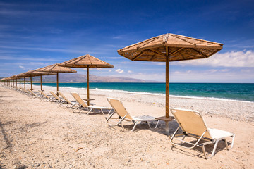 Tropical parasols at Maleme beach on Crete, Greece