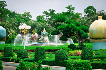 Beautiful garden Chicken King Ban, Sukhavati in Pattaya, Thailand, where a lot of greenery, statues, fountains and beautifully manicured trees