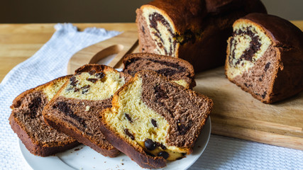 Closeup of freshly baked delicious sweet bread slices ready to be eaten. Traditional Romanian and...