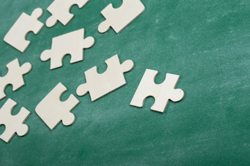 Creative solution for idea - business concept, jigsaw puzzle on the blackboard