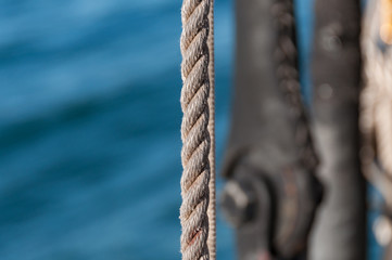 Close up of textured rope with water on the background