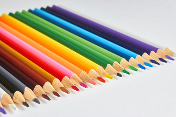A set of colored pencils for drawing on white background