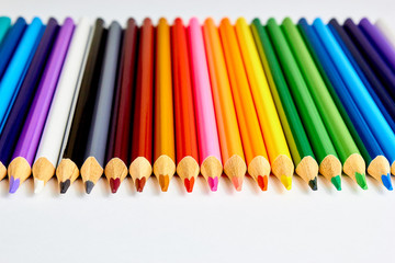 A set of colored pencils for drawing on white background