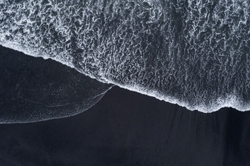 Aerial drone shoot from above black sand beach. Nature texture - Powered by Adobe