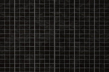 Black brick stone tile wall pattern and seamless background
