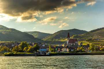 Fototapeta premium Scenic View into the Wachau with the river Danube and town Weissenkirchen in Lower Austria.