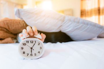 Alarm clock that wakes up in the morning in the bedroom
