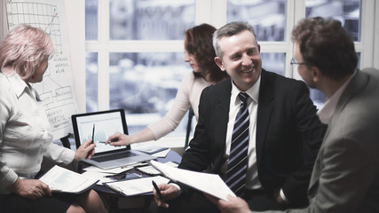 experienced employees discussing problems in the office.