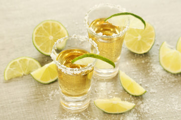 Tequila shots with sliced lime	