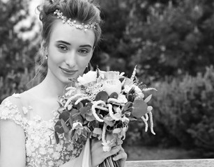 Bride holds a wedding bouquet, wedding dress , wedding details. Wedding ceremony concept.