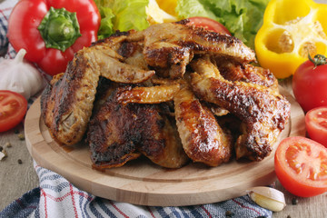 Chicken wings barbecue with different vegetables	