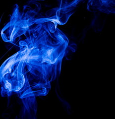 Blue smoke on black background