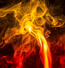Fototapeta premium Colored smoke on black background