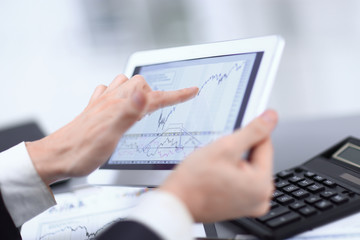 close up.businessman pointing at digital tablet screen