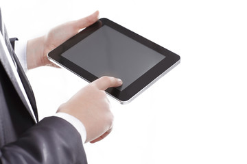 close up.businessman tapping the screen of the digital tablet