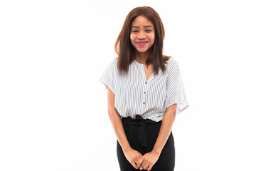 portrait of african young girl possing and gesticulates hands on background