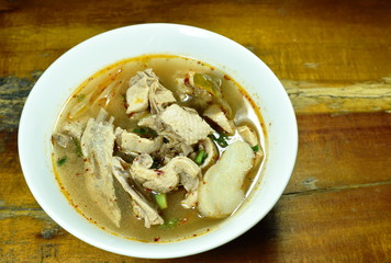 boiled duck bone with herb Thai spicy soup on bowl
