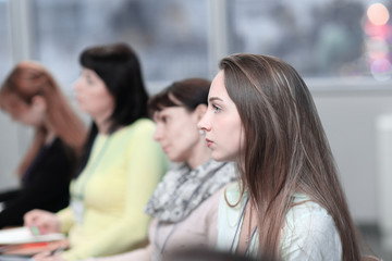 business woman on the background of colleagues in the conference room
