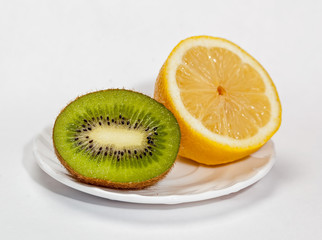 Colored fruit on white background.