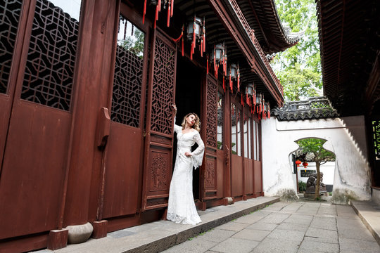 Woman Posing. European Bride In Shanghai, China. White Dress. Outside. Boho Slyle