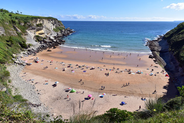 Sunbathers in Playa de Matalenas Beach, Santander, Cantabria, Spain