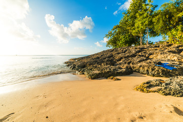 Sun shining over Le Souffleur beach in Guadeloupe
