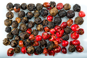 Red, black and brown peppercorns