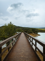 Wooden boardwalk to a desert island