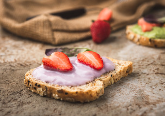 bread wholegrain mashed avocado and blueberry with strawberry 