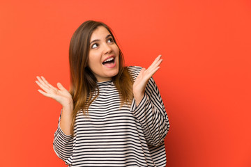 Young girl with striped shirt with surprise facial expression