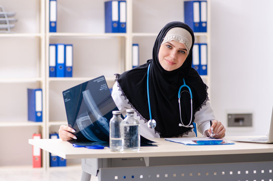 Young doctor in hijab working in the clinic 