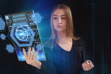 The concept of business, technology, the Internet and the network. A young entrepreneur working on a virtual screen of the future and sees the inscription: Business network