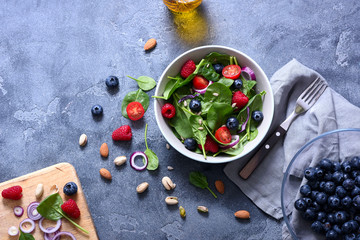 Spinach salad with berries and seeds, healthy snack for lunch