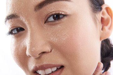 Close up Asian woman looking at camera and being curious