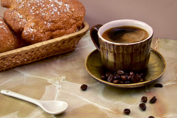 Breakfast - bun and a cup of coffee.