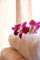 Obraz na płótnie Canvas Orchid flowers on towels