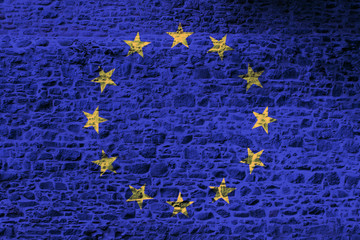 European Union national flag painted on a rough stone wall