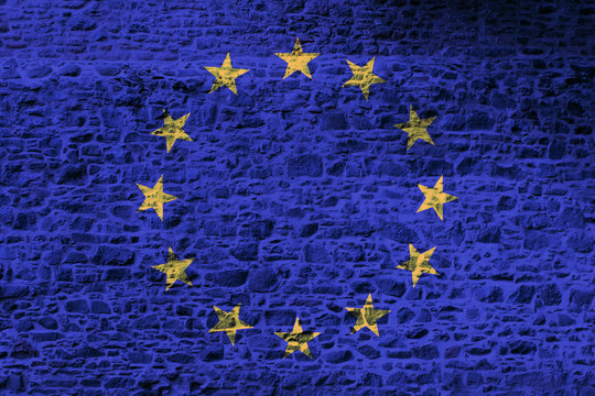 European Union national flag painted on a rough stone wall
