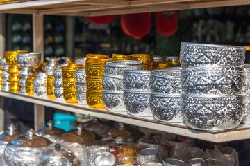 Metal bowls, dishes stacked in one another on display
