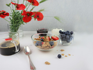 Breakfast served with coffee, cereals and fruits.