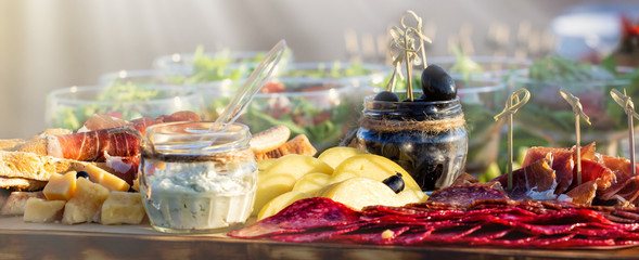 Catering platter with different meat and cheese. Panoramic wiev