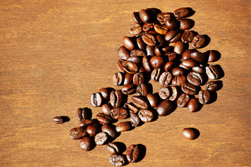Close-up coffee beans on wooden background, aroma photo