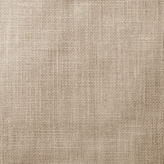 Hessian sackcloth woven texture pattern background in light sepia tan beige cream brown color tone