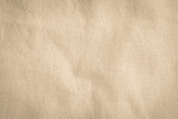 Hessian sackcloth woven texture pattern background in light creme yellow beige color earth tone
