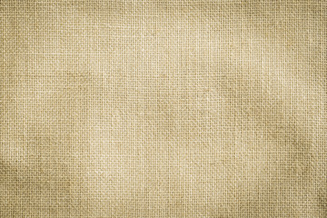 Hessian sackcloth woven texture pattern background in yellow beige cream brown color